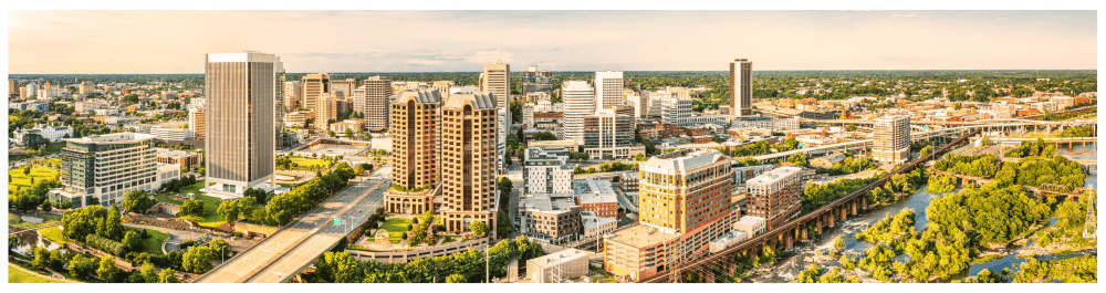 Downtown Richmond skyline highlighting Tidewater Roofing's 24/7 emergency repair service, with fully stocked service trucks offering quality roofing repairs and insurance services across Hampton Roads, Richmond, and surrounding areas.