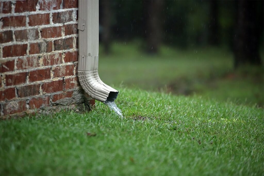 Water pouring from downspout.