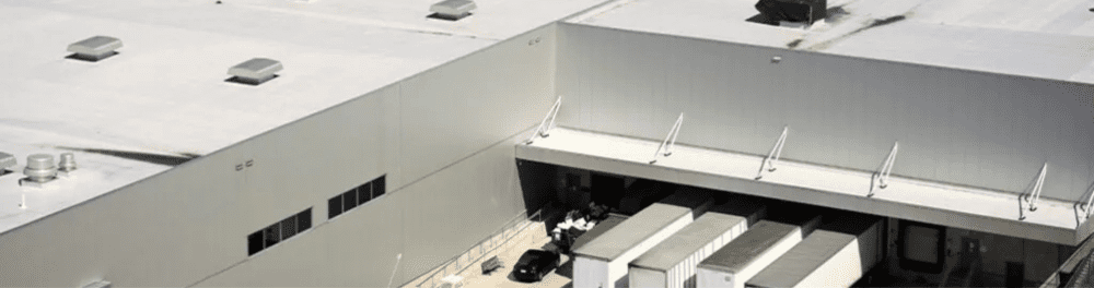 A commercial flat-roofed building that would benefit from box gutter installation.