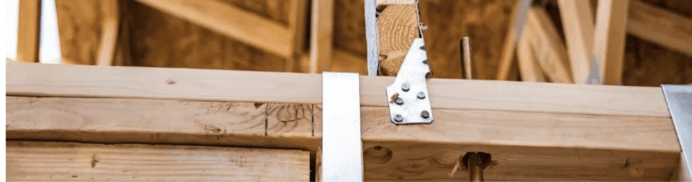 A close up image of roofing brackets in the attic of a Hampton Roads home.