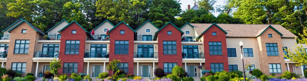 Virginia row houses shown from the front, their gutter systems are clearly visible