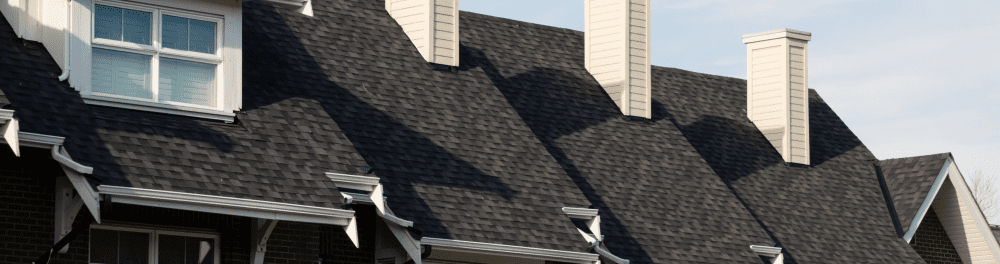 An image of newly installed impact-resistant shingles on a multi-family property.