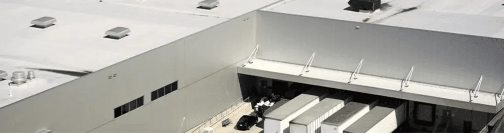 A commercial flat-roofed building that would benefit from box gutter installation.